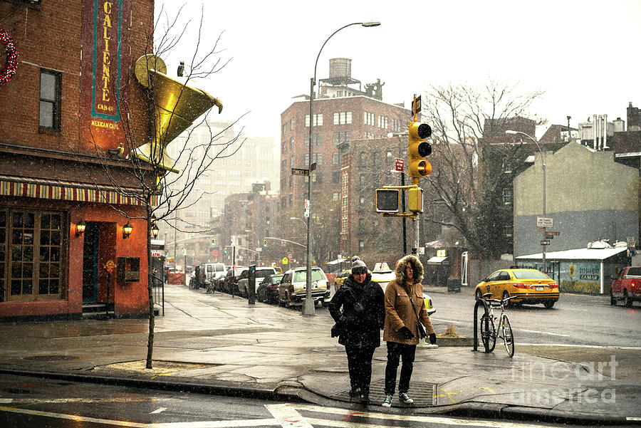 The Village Photograph - Bundled Up on 7th Avenue in New York City by John Rizzuto