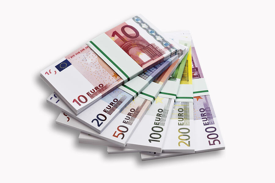 Bundles of Euro banknotes on white background, close-up Photograph by Tuned_In
