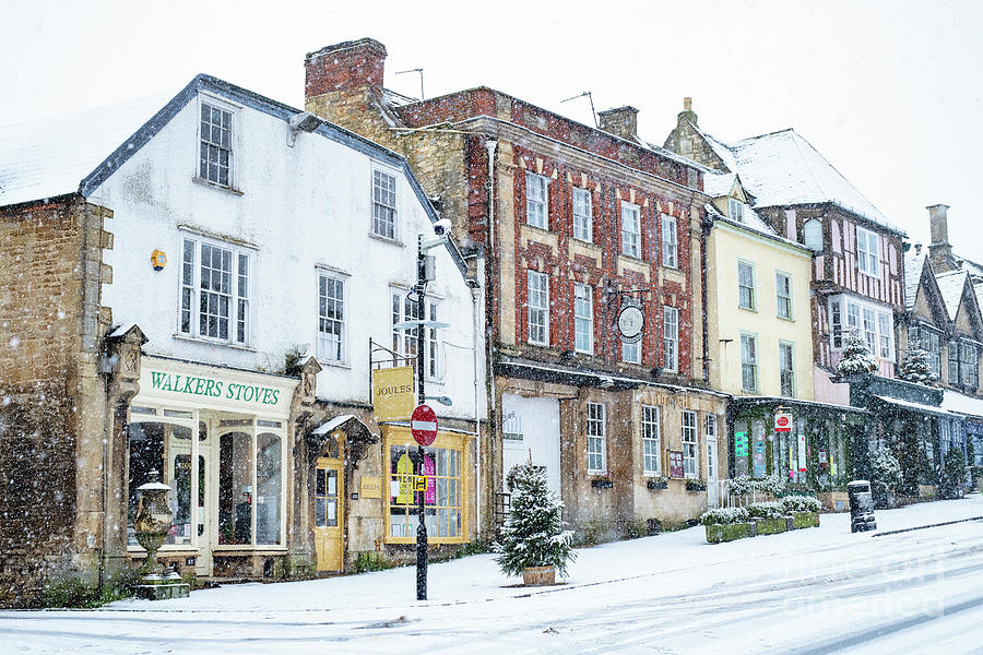 Burford High Street in the December Snow Photograph by Tim Gainey