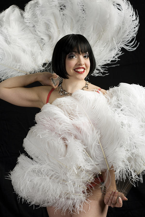 Burlesque dancer with feather fans, portrait Photograph by Henry Horenstein