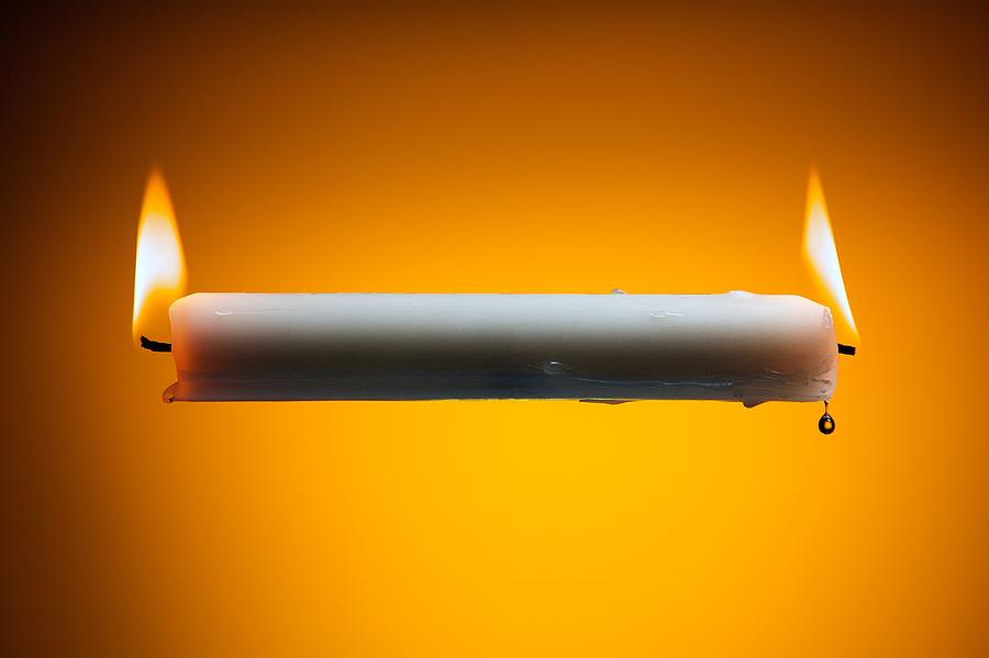 Burning candle at both ends Photograph by Todd Hakala Photography -- toddhakala.com