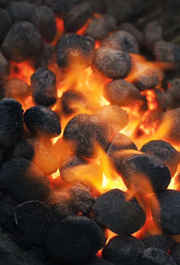 Burning charcoal, close-up Photograph by Johner Images