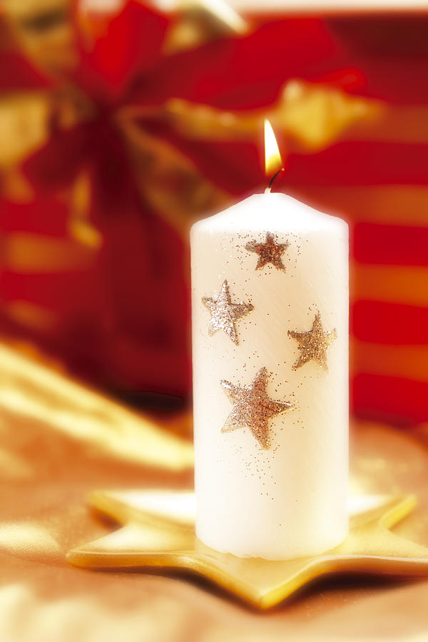 Burning Christmas candle, close-up Photograph by Creativ Studio Heinemann