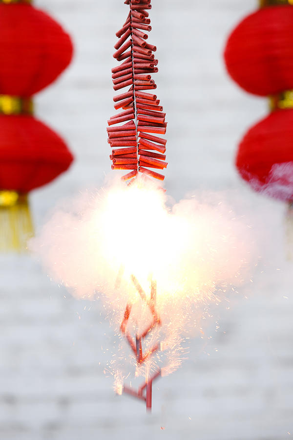 Burning firecrackers and red lanterns Photograph by View Stock