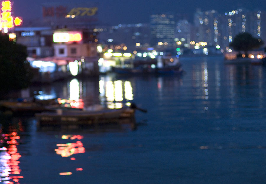 Burred lights reflected in harbour water Photograph by Lyn Holly Coorg