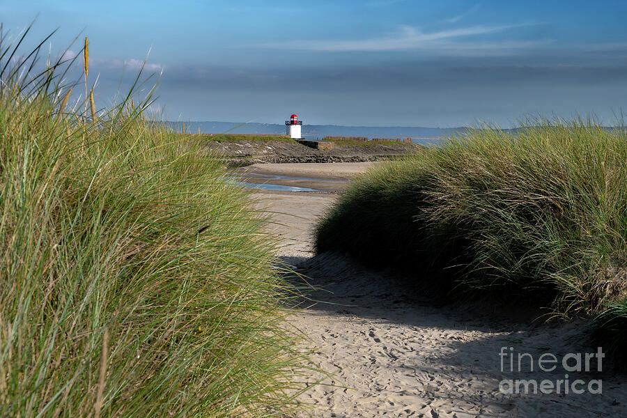 Burry Port Lighthouse And Sandy Beach With Dunes In Carmarthenshire, Wales, United Kingdom Photograph by Andreas Berthold