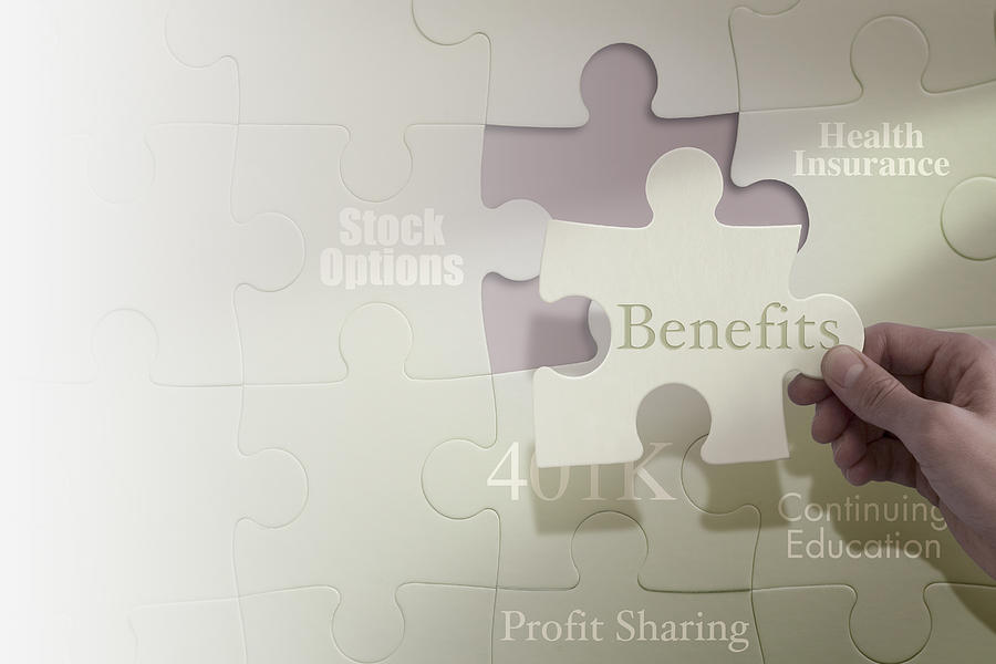 Business concepts on puzzle pieces Photograph by Comstock Images