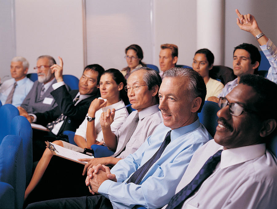 Business Executives in a Conference Room Asking Questions Photograph by Digital Vision.