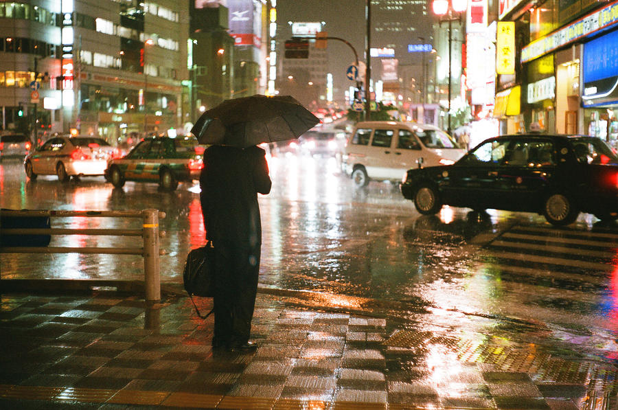 Business man in the rain at night Tokyo Photograph by Photography By Bert.design