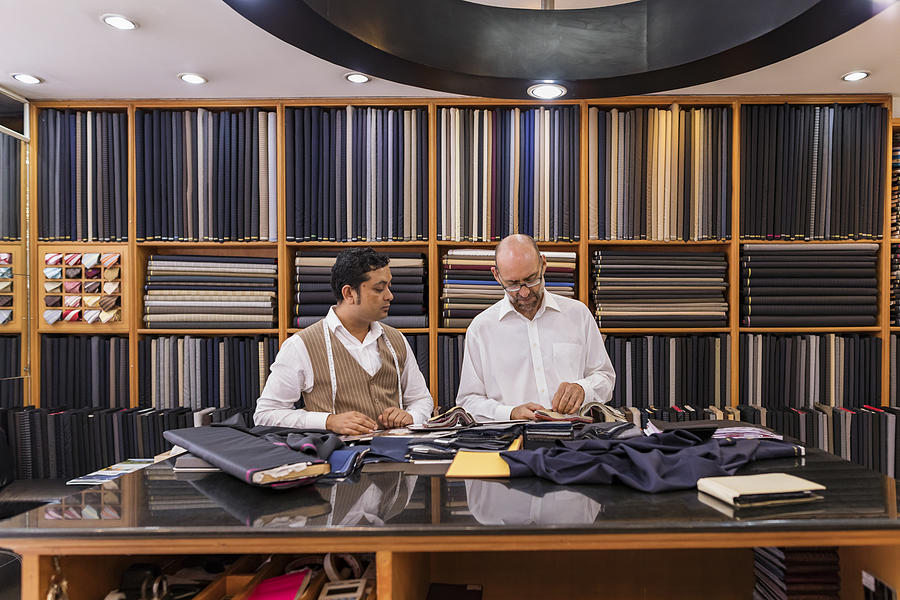 Business Man Selecting Fabric For a Custom Tailored Suit Photograph by Davidf