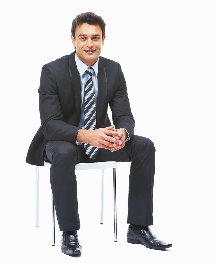 Business man sitting against white background Photograph by Goodboy Picture Company