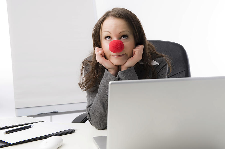 Business woman with a red clown nose Photograph by Michaela Begsteiger