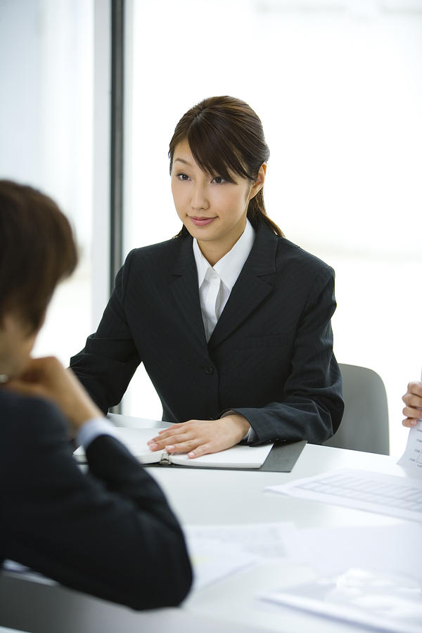 Businessman And Businesswoman In Meeting, Head and Shoulder, Front View, Rear View,  Photograph by Daj