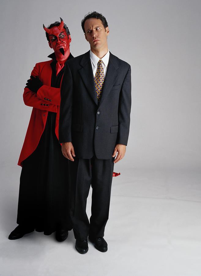 Businessman and Devil Photograph by Stockbyte