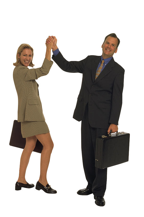 Businessman and woman congratulating, each other Photograph by Comstock