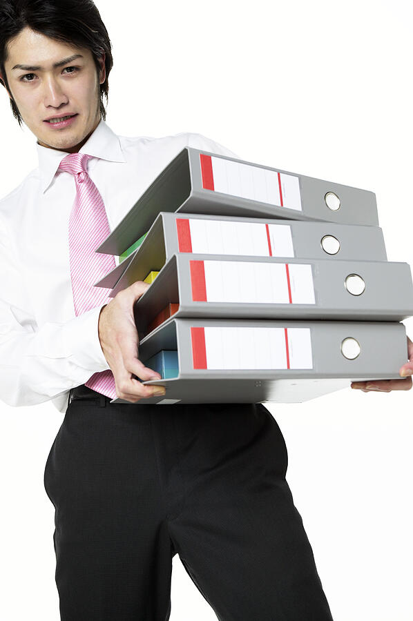 Businessman Carrying a Stack of Folders Photograph by Mash