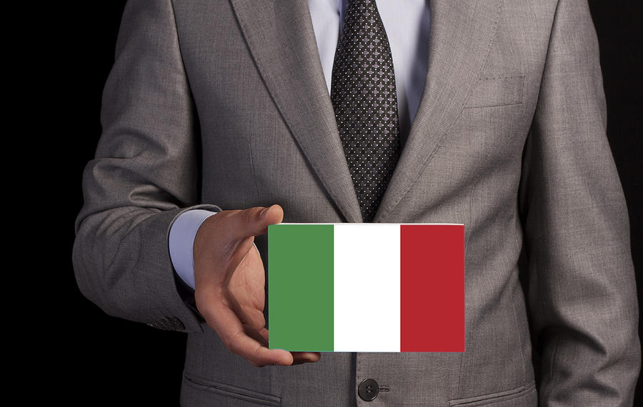 Businessman Holding a Card with ITALY Flag Photograph by Cnythzl