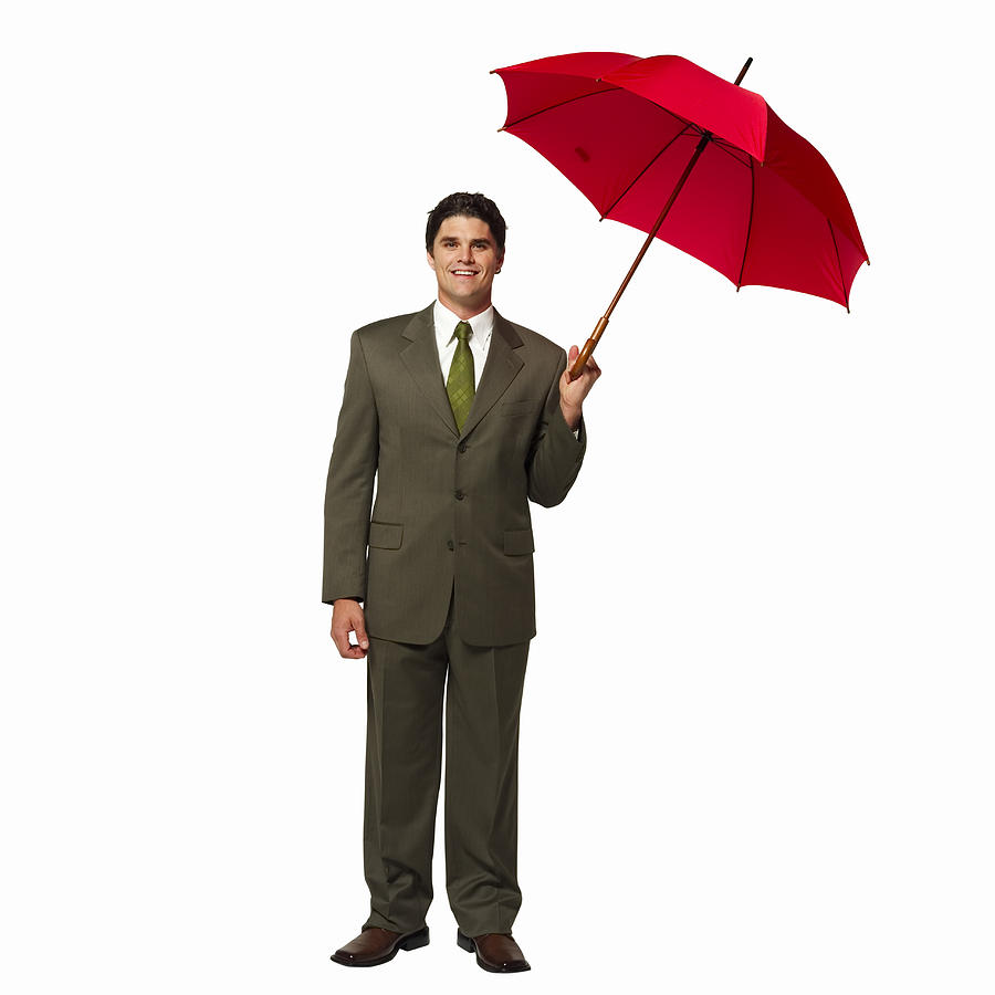 Businessman holding an umbrella Photograph by George Doyle & Ciaran Griffin