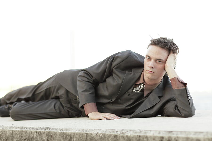 Man Photograph - Businessman in a laying pose print photo by Felix Mizioznikov