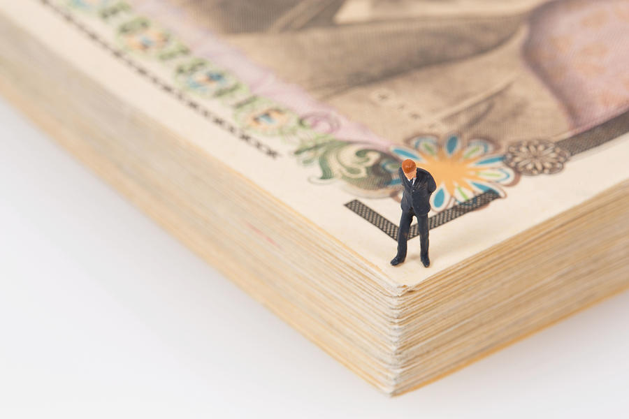 Businessman on Money Photograph by Yuichiro Chino