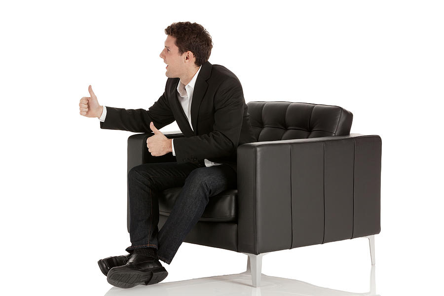 Businessman sitting in armchair Photograph by 4x6