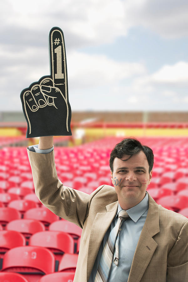 Businessman sports fan with foam hand Photograph by Image_Source_