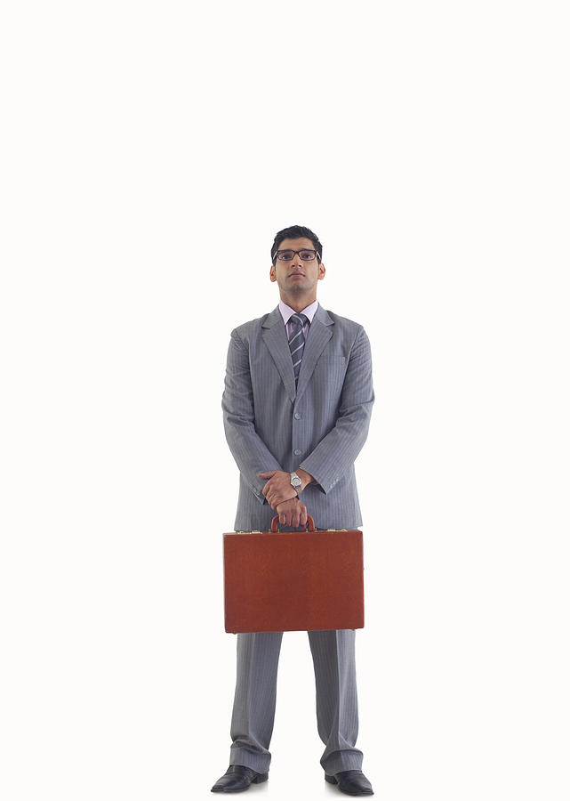 Businessman standing with suitcase Photograph by Abhinandita Mathur