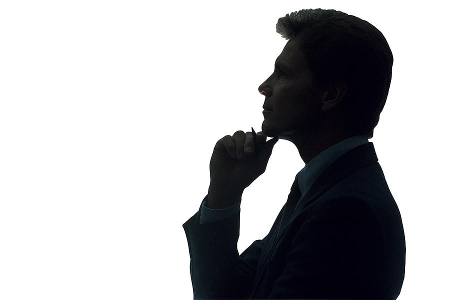 Businessman thinking in silhouette Photograph by Comstock
