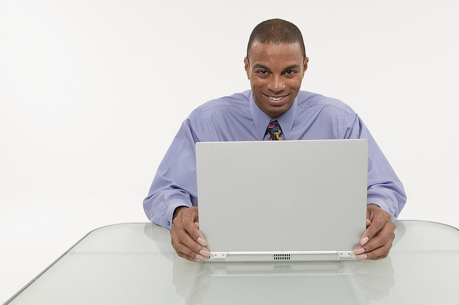 Businessman using a laptop Photograph by Comstock Images