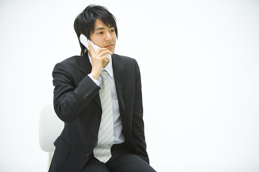 Businessman Using a Mobile Phone, Front View, Copy Space  Photograph by Daj