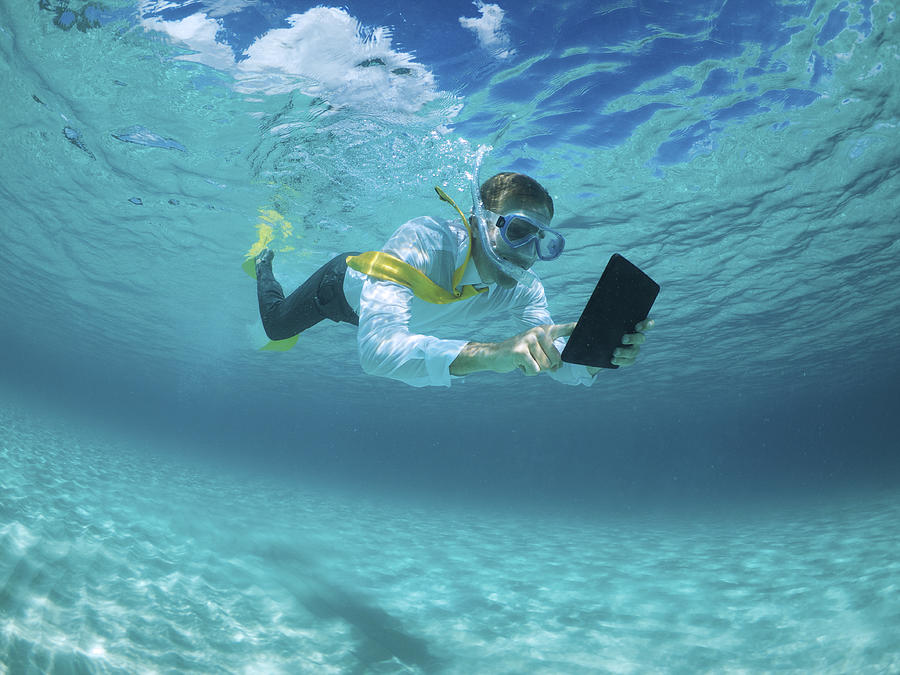 Businessman Using Digital Tablet Computer Underwater Snorkeling Photograph by PeskyMonkey