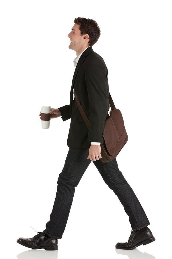 Businessman walking with a disposable cup Photograph by 4x6