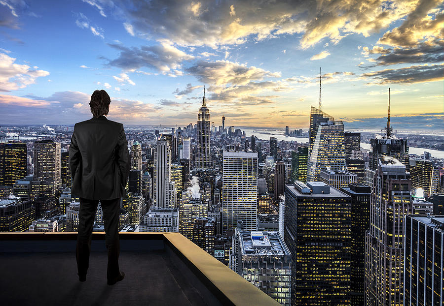 Businessman watching the New York City on the rooftop of skyscraper Photograph by Guvendemir