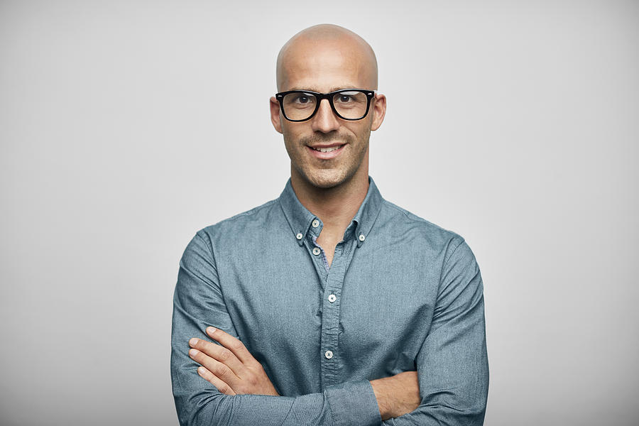 Businessman Wearing Eyeglasses On White Background Photograph by Morsa Images