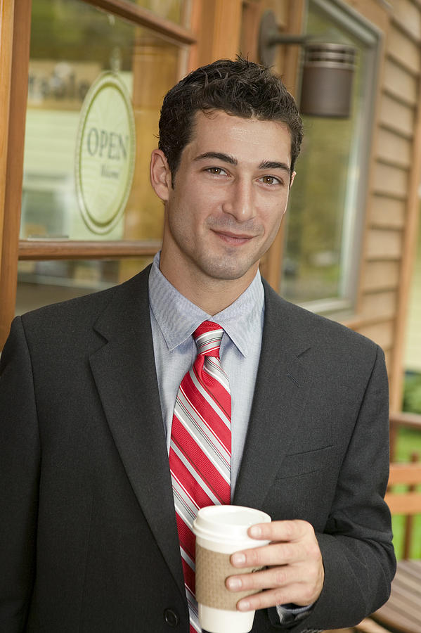 Businessman with coffee Photograph by Comstock Images