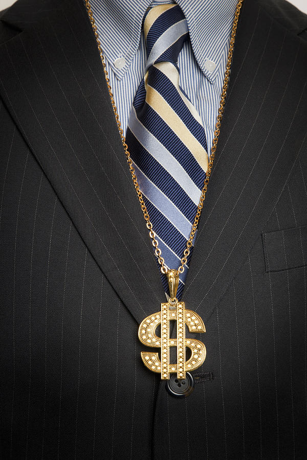 Businessman with gold dollar sign bling necklace Photograph by Gary S Chapman