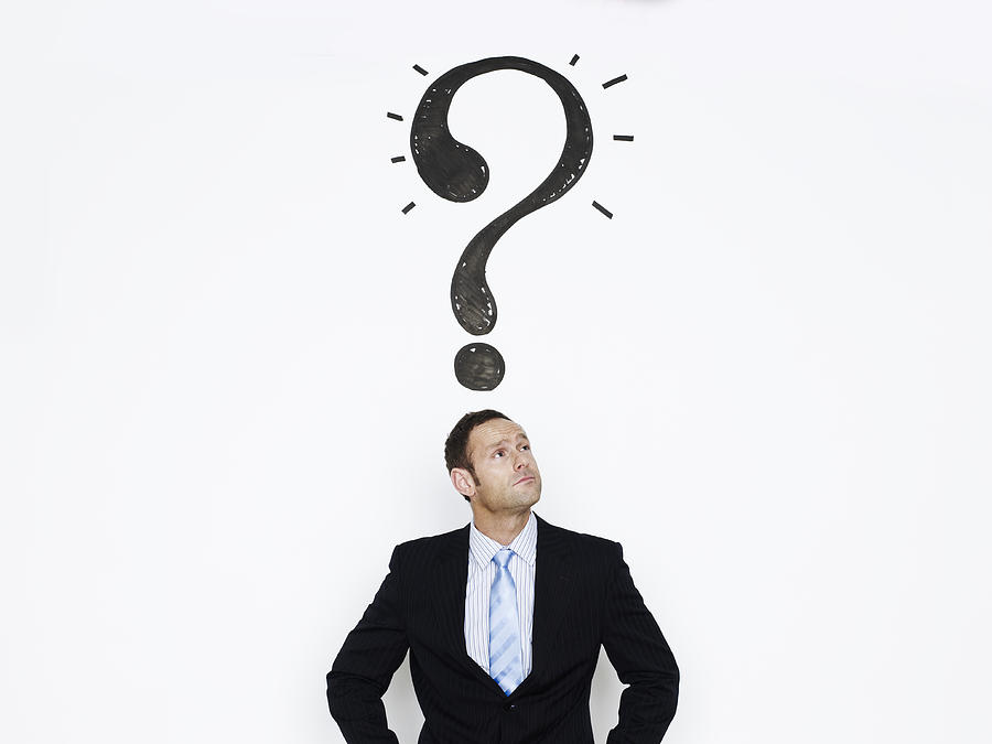 Businessman with question mark over his head Photograph by Flashpop