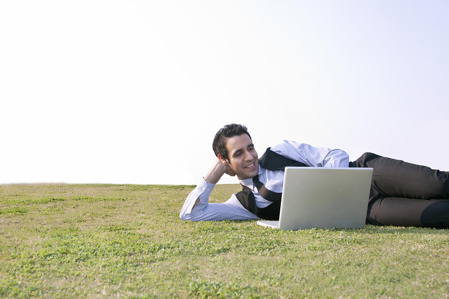 Businessman working on a laptop , INDIA , DELHI Photograph by Sudipta Halder