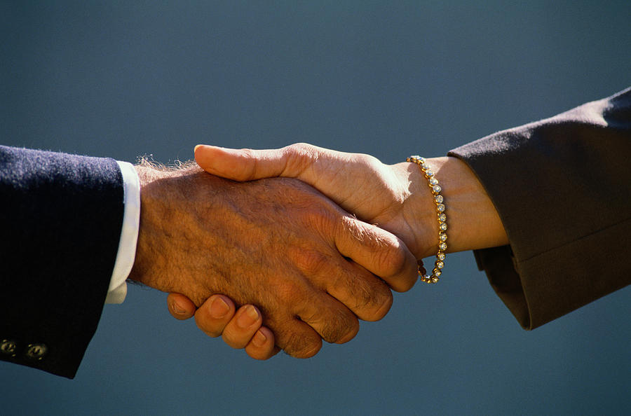 Businessmans & Womans Handshake Photograph by Bread and Butter