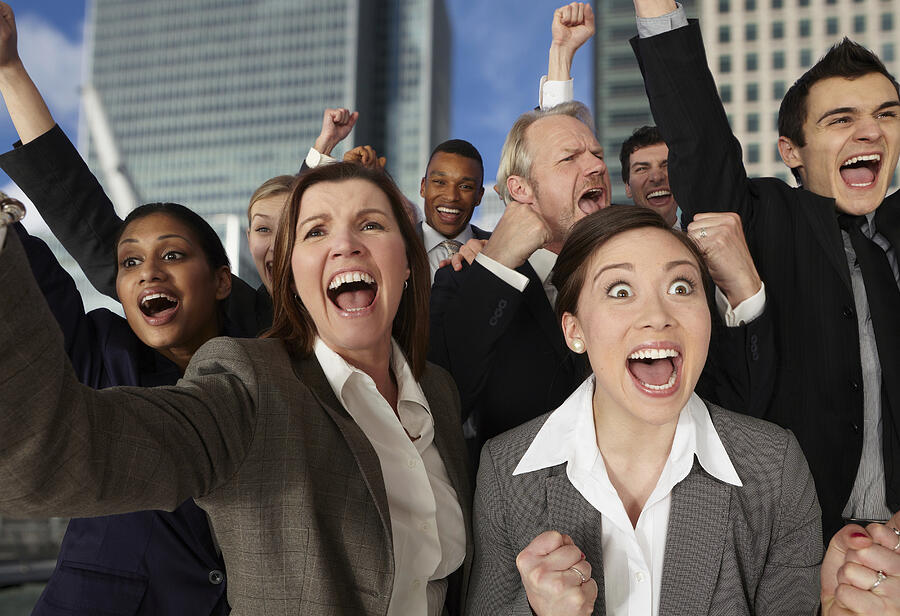 Businesspeople cheering with excitement Photograph by Image Source
