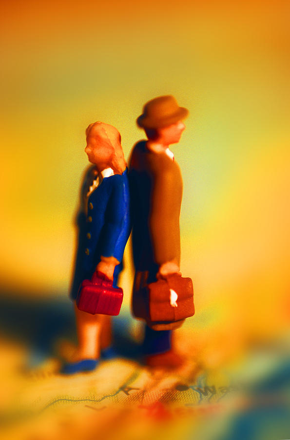 Businesspeople figurine standing back to back, side view Photograph by John Foxx