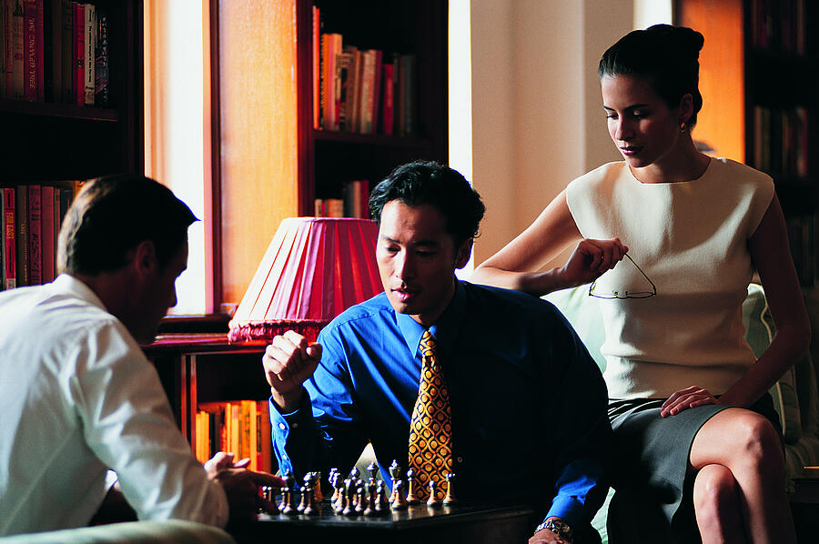Businesspeople playing game of chess Photograph by Photodisc