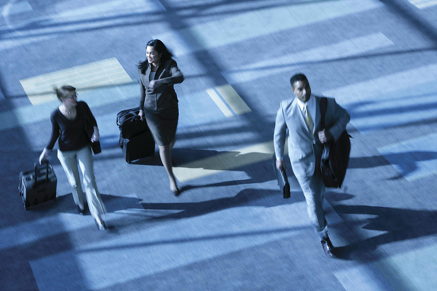Businesspeople with luggage Photograph by Comstock Images