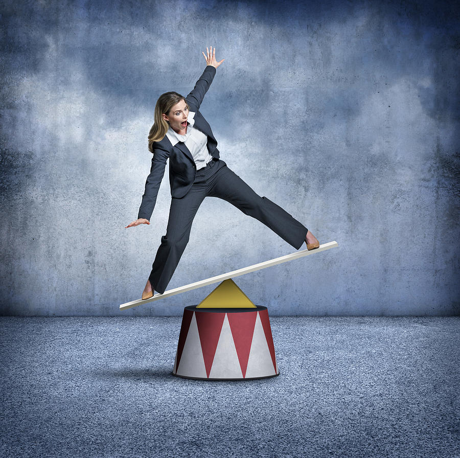 Businesswoman Balancing On A Circus Pedestal Photograph by Dny59