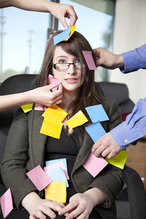 Businesswoman covered with sticky notes Photograph by Patrickheagney