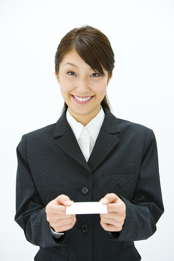 Businesswoman Exchanging Business Cards, Smiling, Three Quarter Length, Front View Photograph by Daj