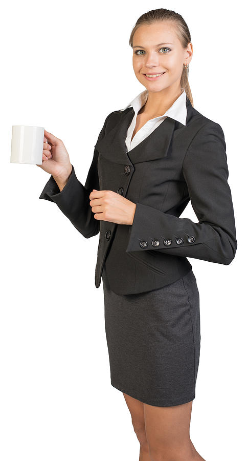 Businesswoman holding mug Photograph by Cherezoff