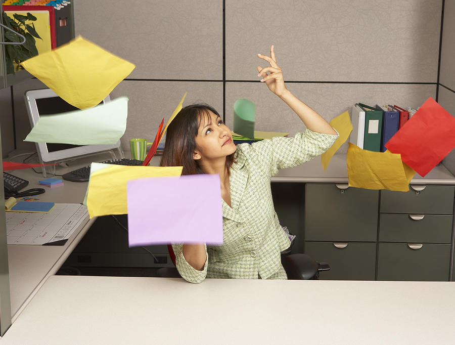 Businesswoman throwing office papers Photograph by John M Lund Photography Inc