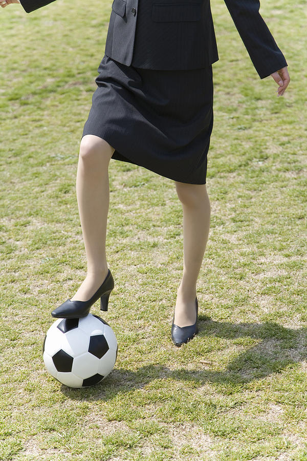 Businesswomans Foot on a Ball, Front View Photograph by Daj