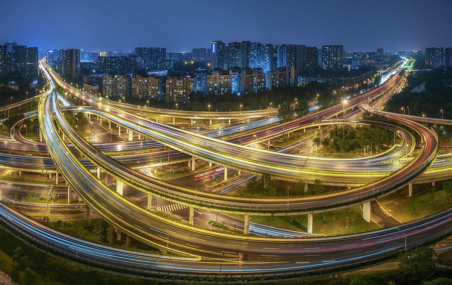Busy interchange at night in China Photograph by Philippe Lejeanvre